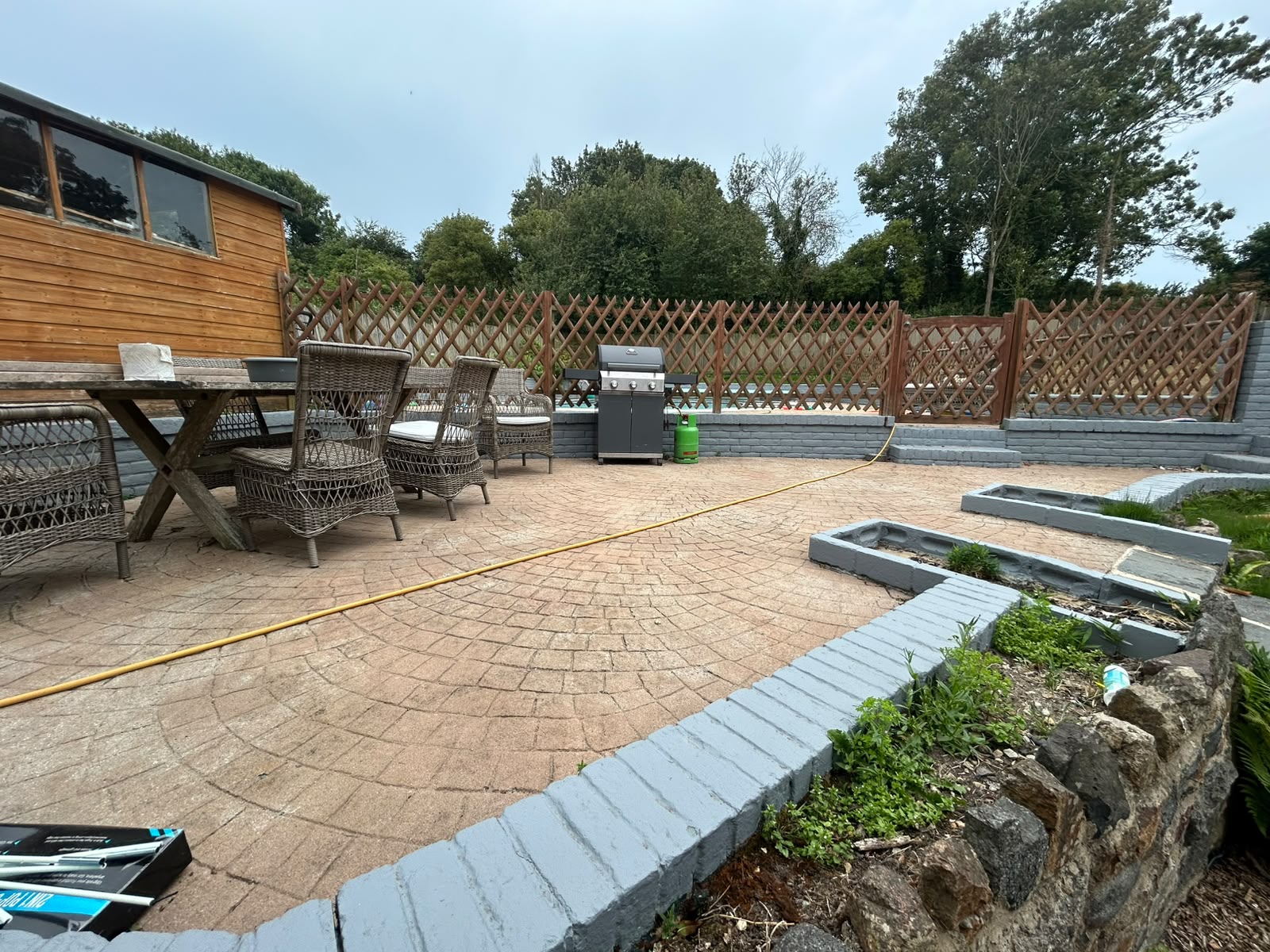 Patio and boundary walls painted slate grey to match the main property