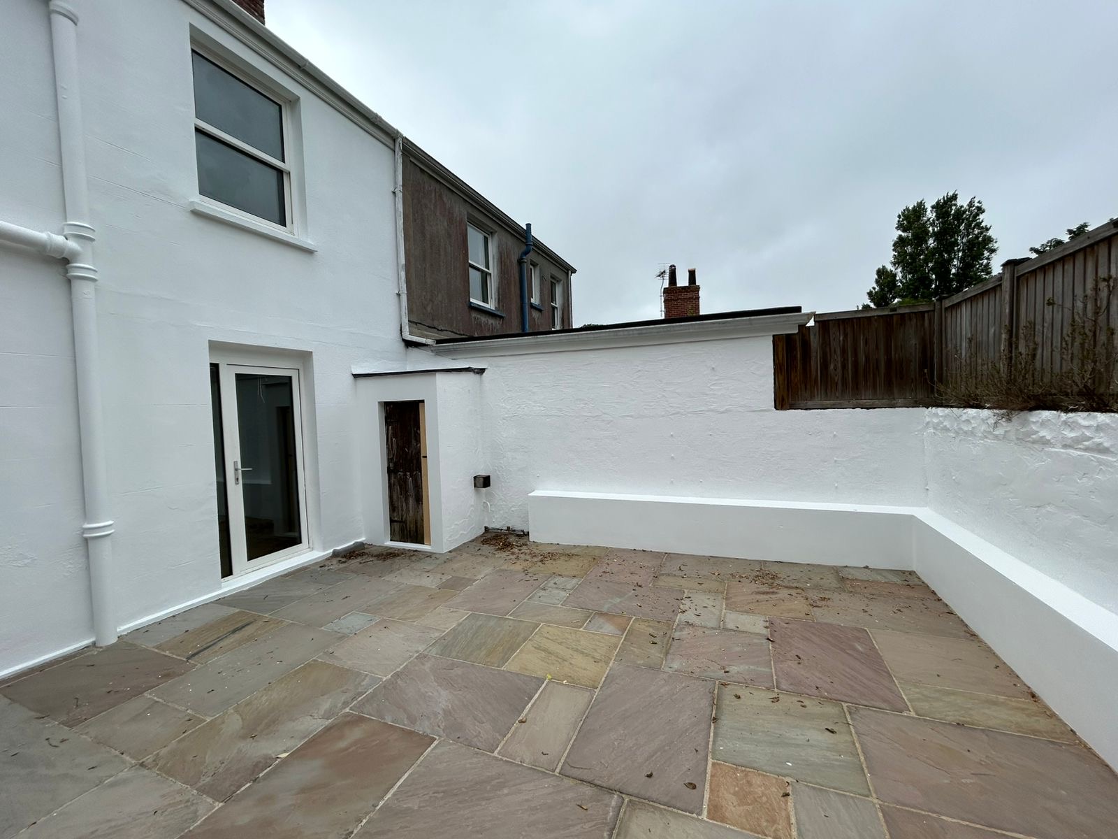Exterior painting detail on doors and woodwork at a Guernsey property
