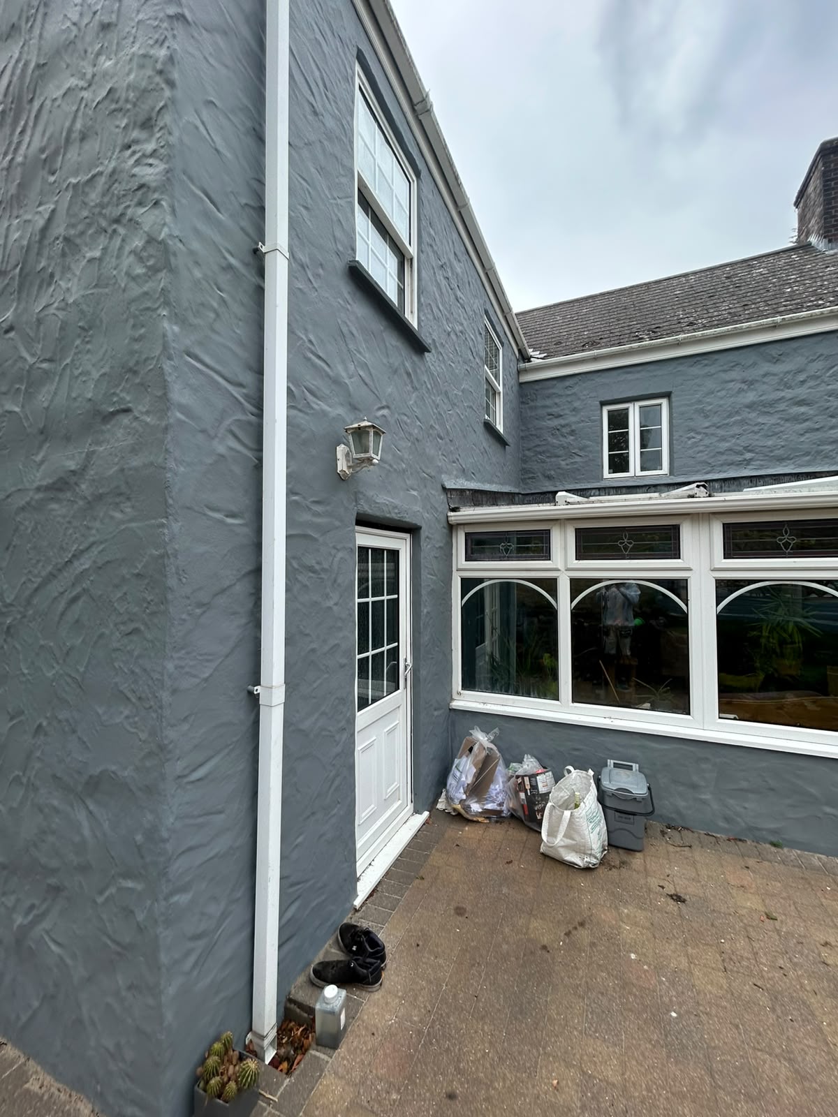 Slate grey exterior repaint on a Guernsey home by Woody's Decorating