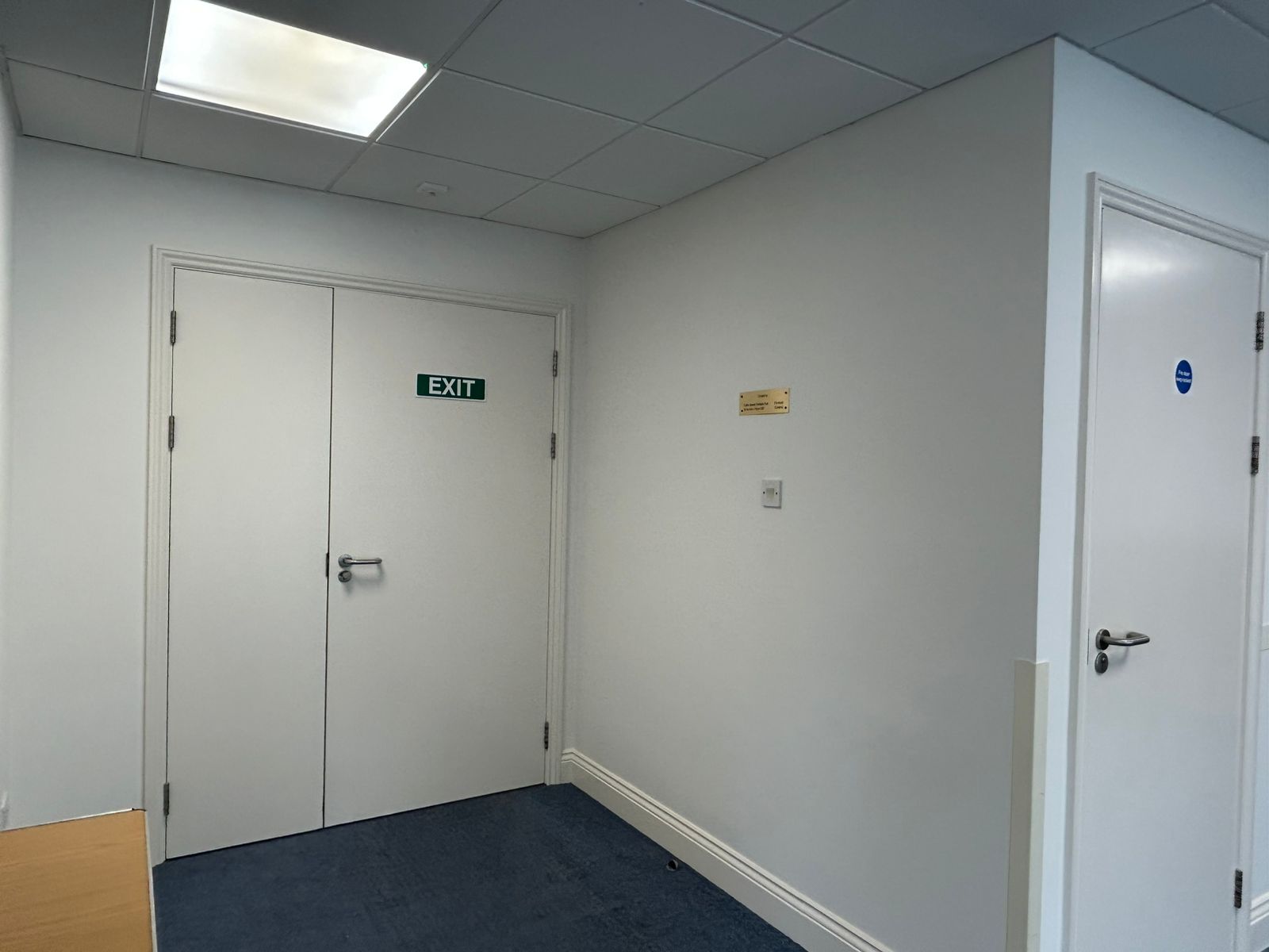 Commercial entrance area decorated in fresh white throughout
