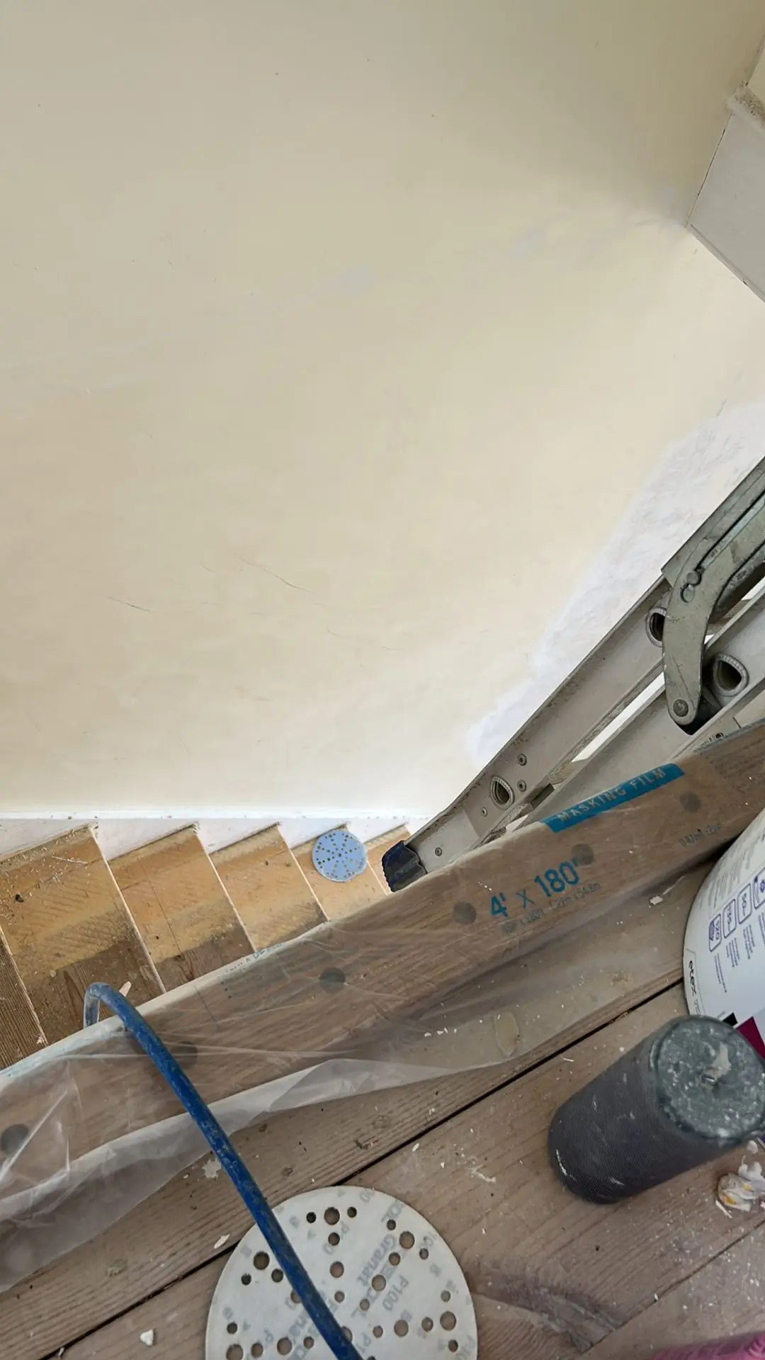 Door frame before — raw plasterboard and tape joints