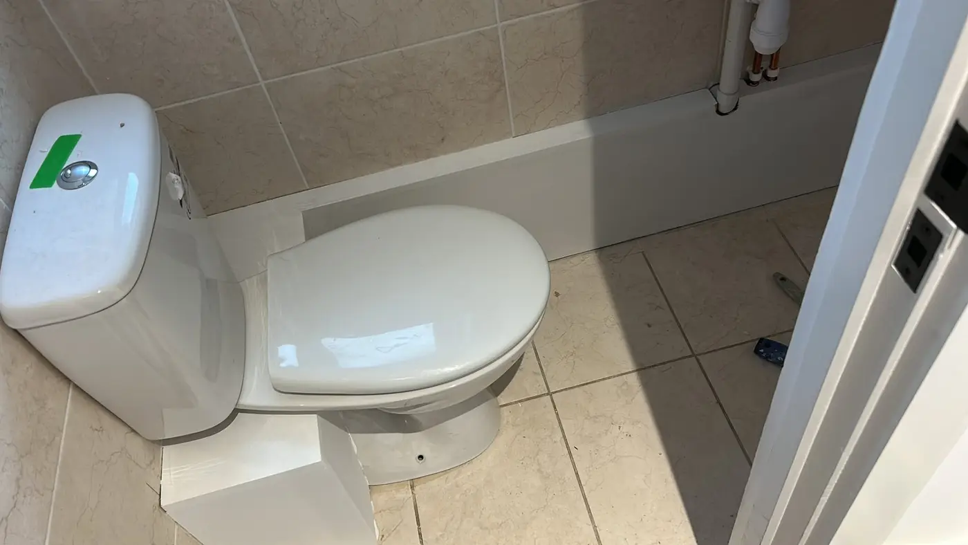 Downstairs WC with tiled walls and new toilet fitted