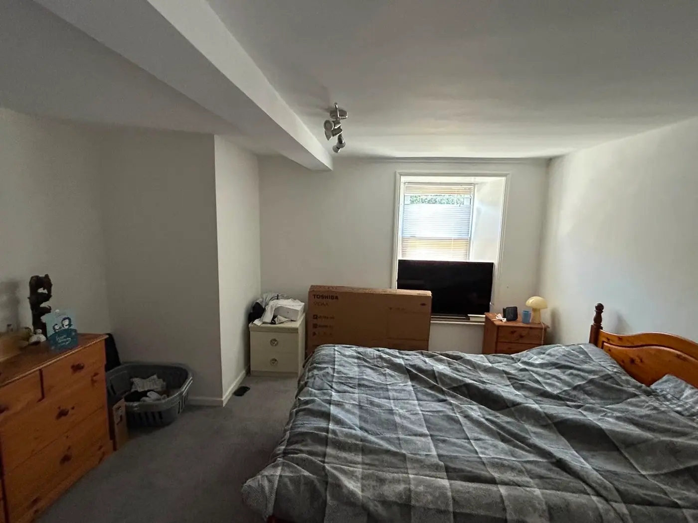 Master bedroom finished in cool, neutral tones with freshly painted walls and ceiling