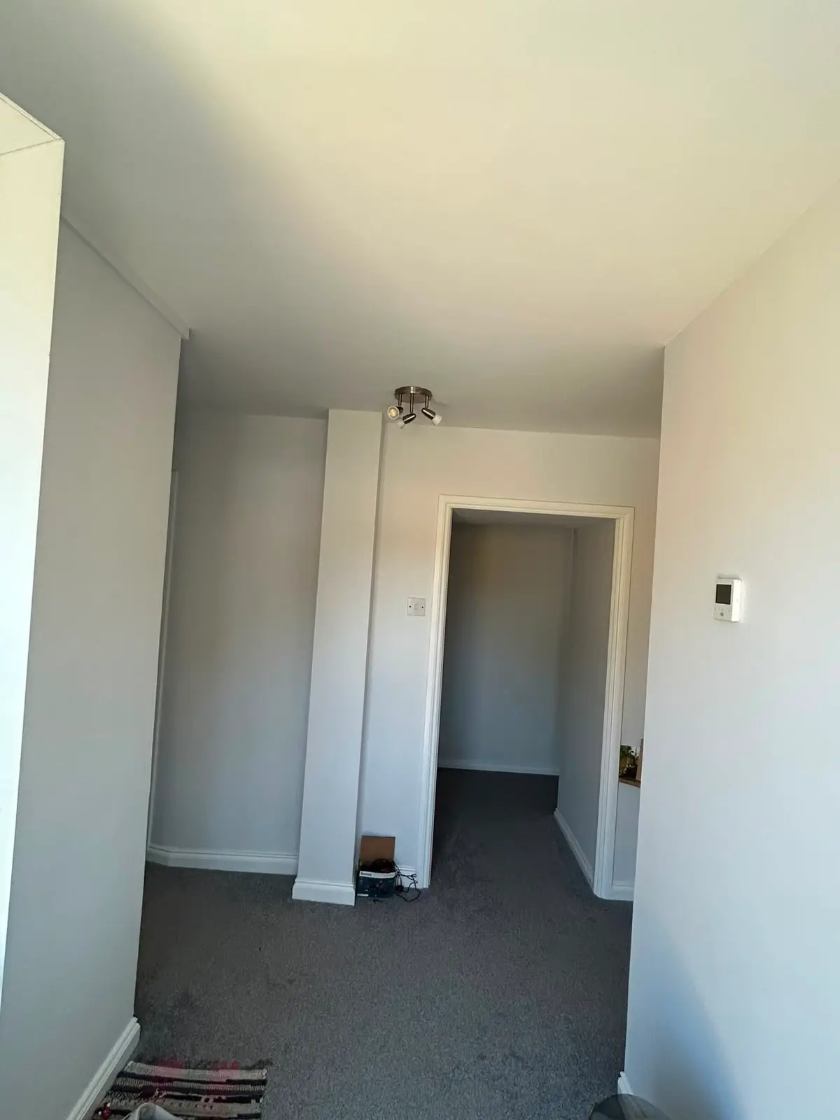 Landing area with clean split two-tone walls and white trim