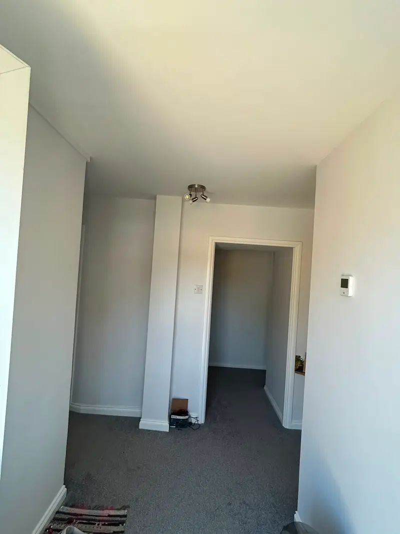 Freshly painted bedroom interior by Woody's Decorating in Guernsey