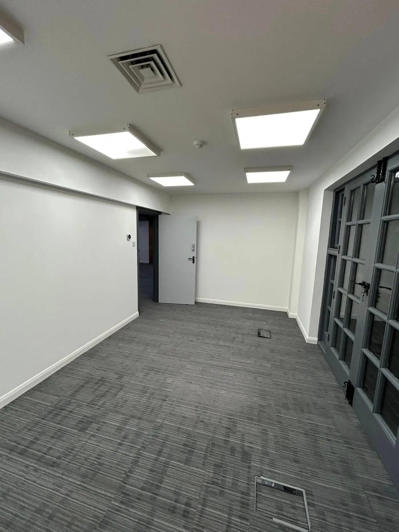 Office room with French doors and clean white finish