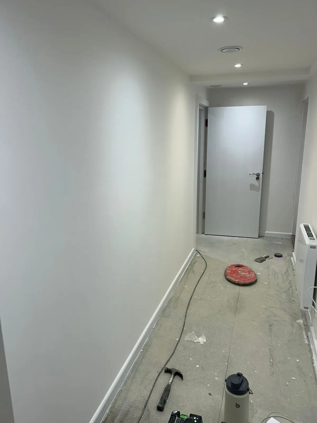 Hallway freshly painted with clean white walls