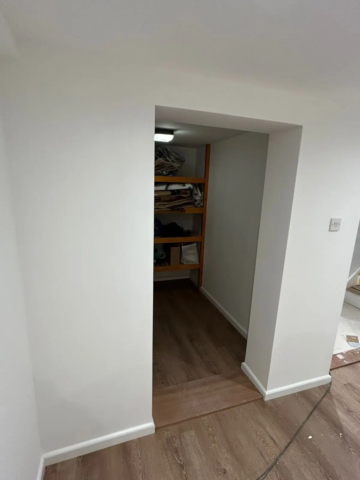 Storage area and doorway with clean painted finish