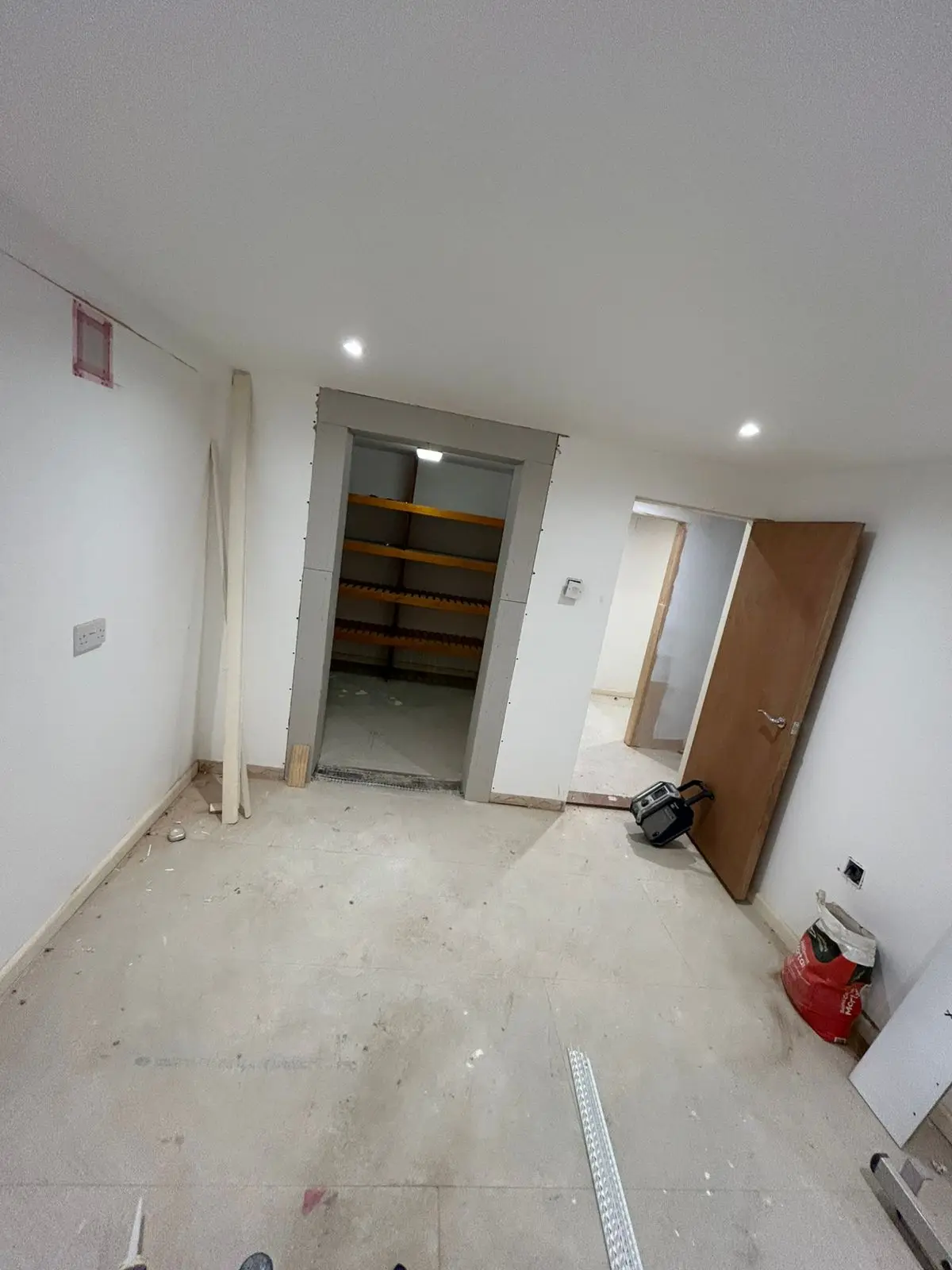 Room before — painted walls with storage doorway