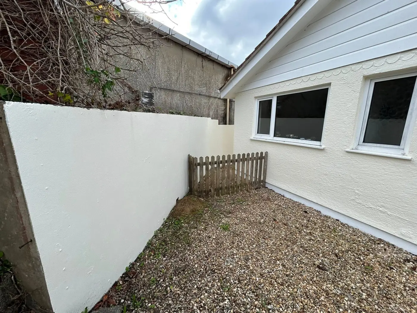 Exterior masonry wall with fresh weatherproofed paint finish