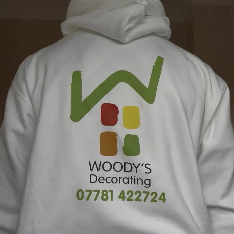 Woody's Decorating branded hoodie showing the company logo and phone number